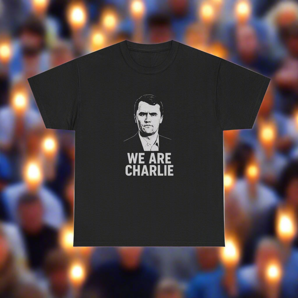 Black t-shirt with a graphic of a person and 'WE ARE CHARLIE' text on a white background