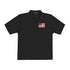 Black polo shirt with a small flag patch on a white background