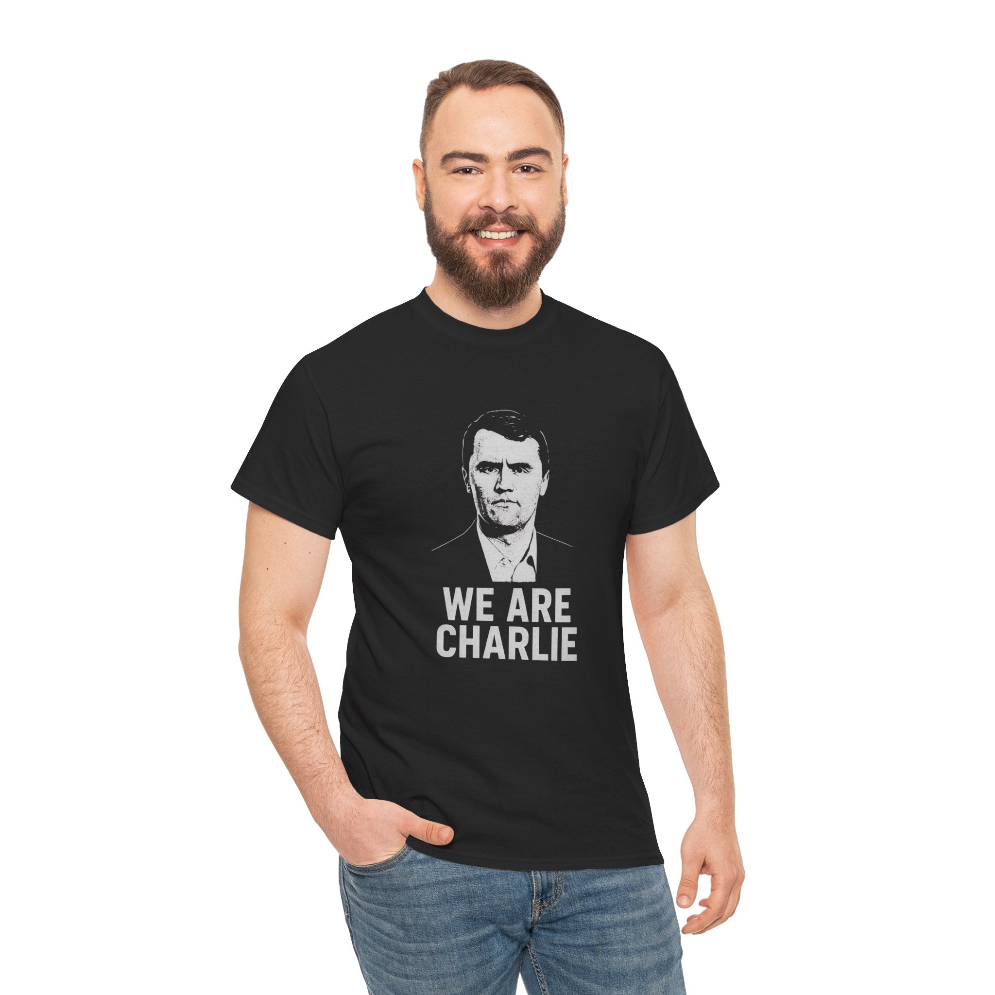 Man wearing a black t-shirt with 'WE ARE CHARLIE' text and graphic on a white background