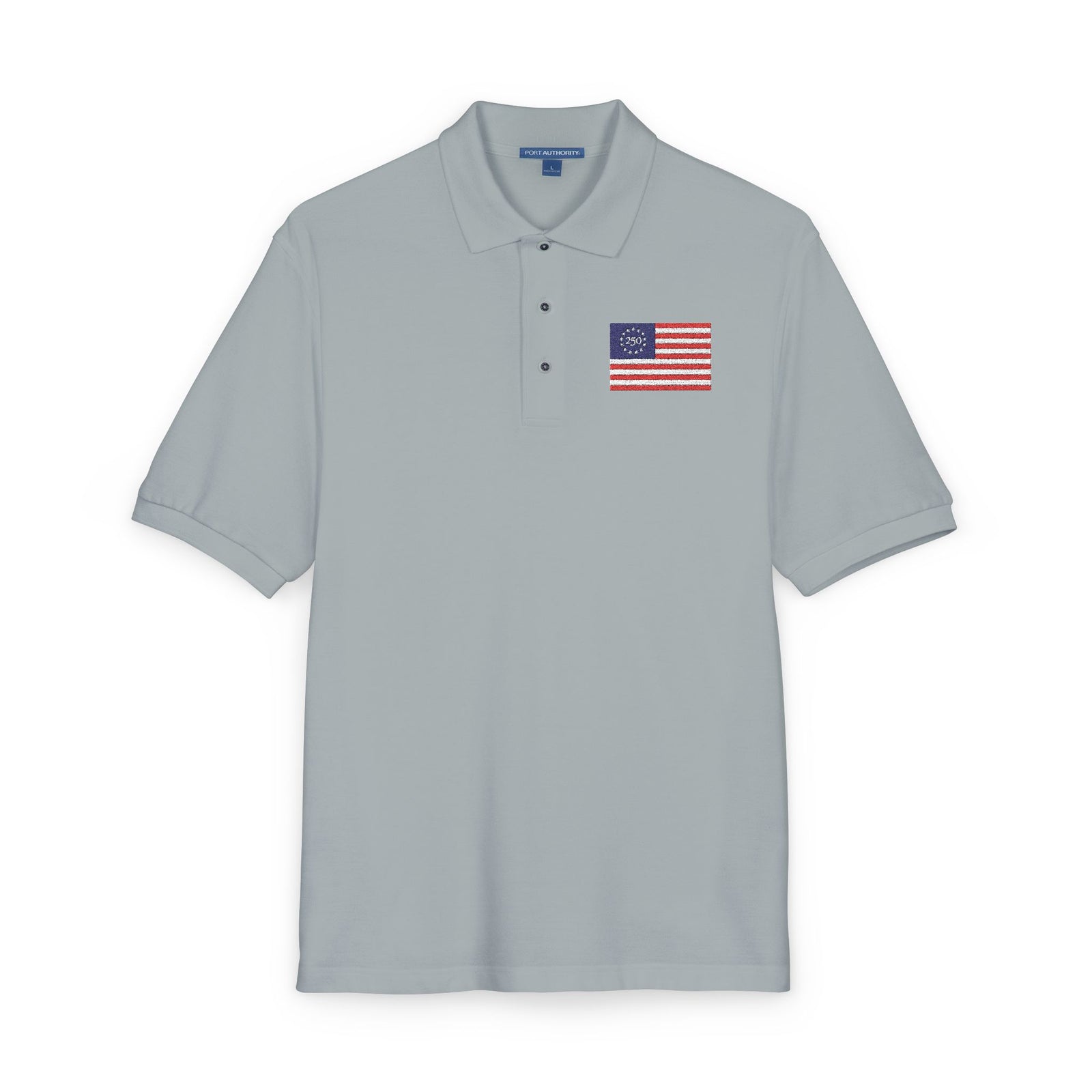 Gray polo shirt with a small American flag patch on a white background